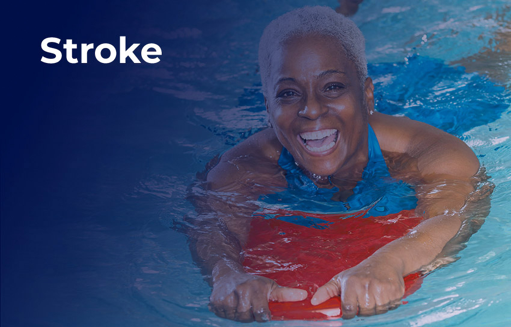 Smiling woman floating in pool holding kick board